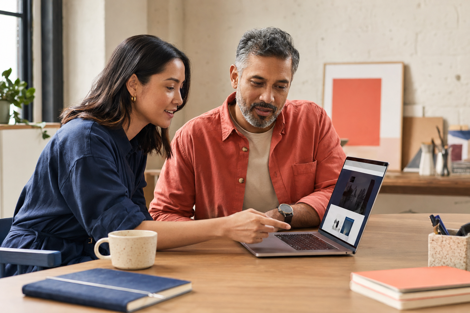 A business owner and growth strategist collaborating on a website strategy